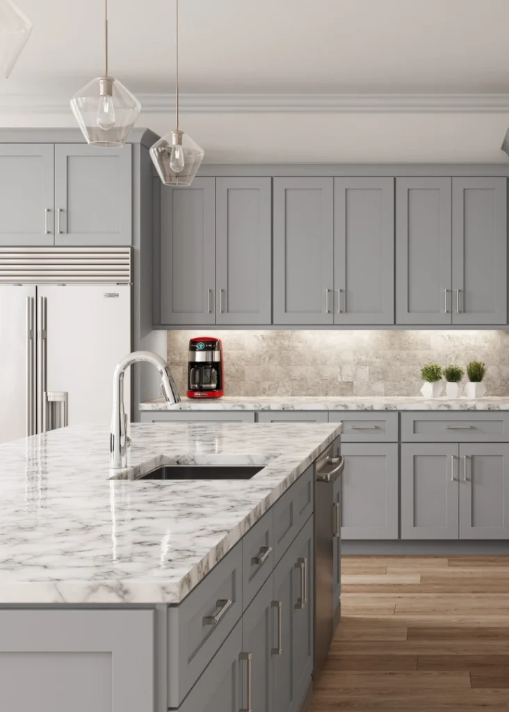 light grey kitchen cabeinets with white and grey granite countertop